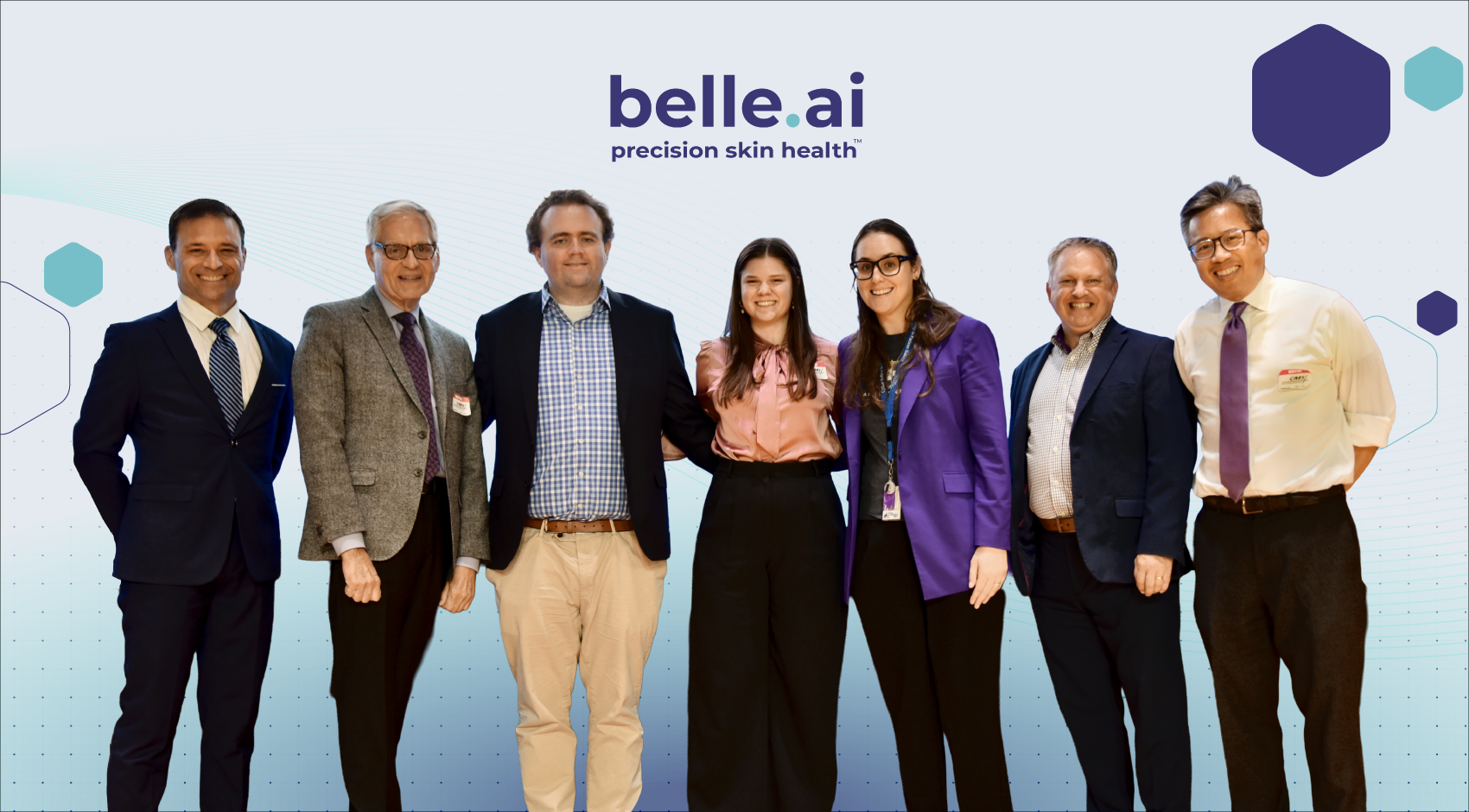 Belle.ai, precision skin health; group photo of smiling staff: Matthew Gloss, Dr. John Romano, Luke Morrissey, Carolyn Privette, staff member, Don Minton, and Ly Tran.